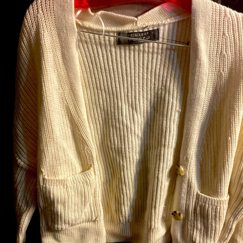 Small White cardigan. Fair condition. Vey cute